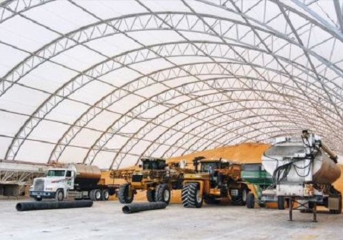 A fabric building is seen being used for agricultural storage. Greenfield Contractors builds Fabric Storage Buildings in Galesburg IL.