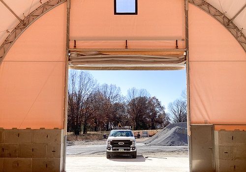 A fabric structure being used to store vehicles is pictured. Greenfield Contractors builds fabric storage buildings in Bloomington IL.